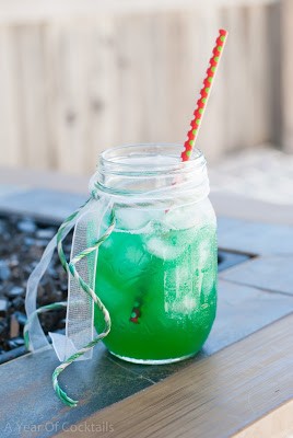 Green Tropics cocktail, coconut rum, malibu rum, pineapple juice, blue curacao, melon liqueur, midori