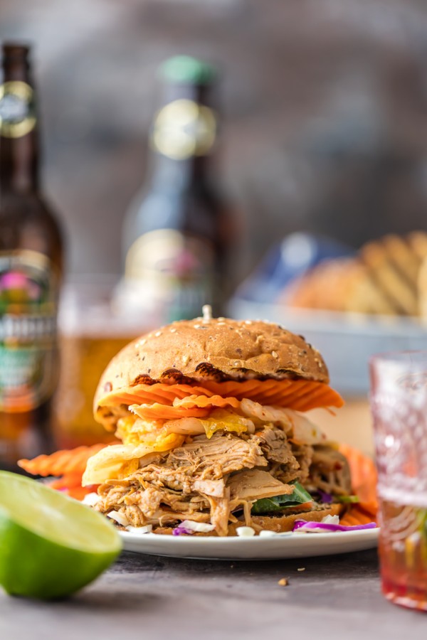 Wow the family with SLOW COOKER DRUNKEN GARLIC GINGER PULLED PORK SANDWICHES! Made in a crockpot with ginger beer! DELICIOUS way to tailgate or enjoy an easy recipe at home!