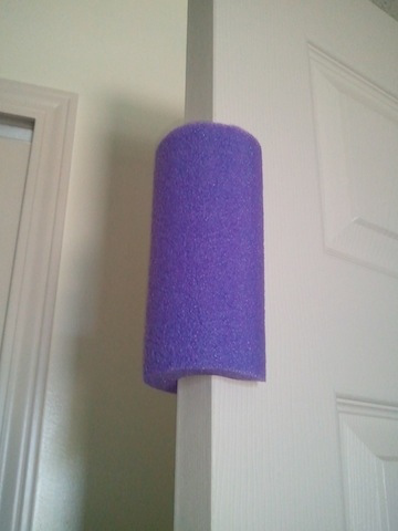 Repurpose a pool noodle to become a toddler-proof door stopper.