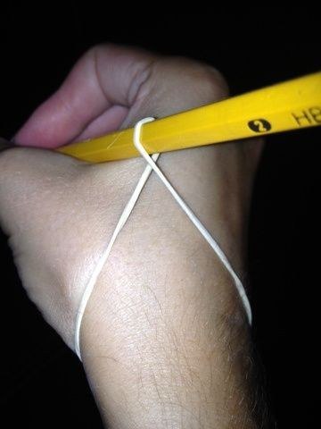 A rubber band will help kids grip pencils better.