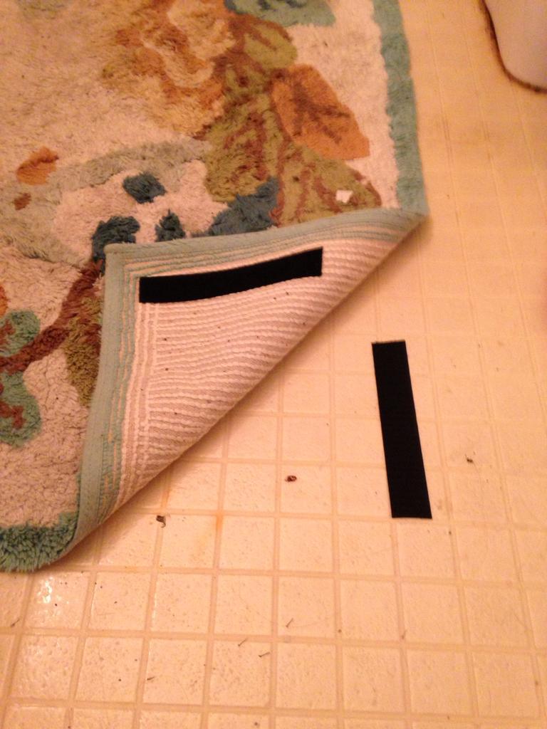 Velcro can help keep rugs tidy.