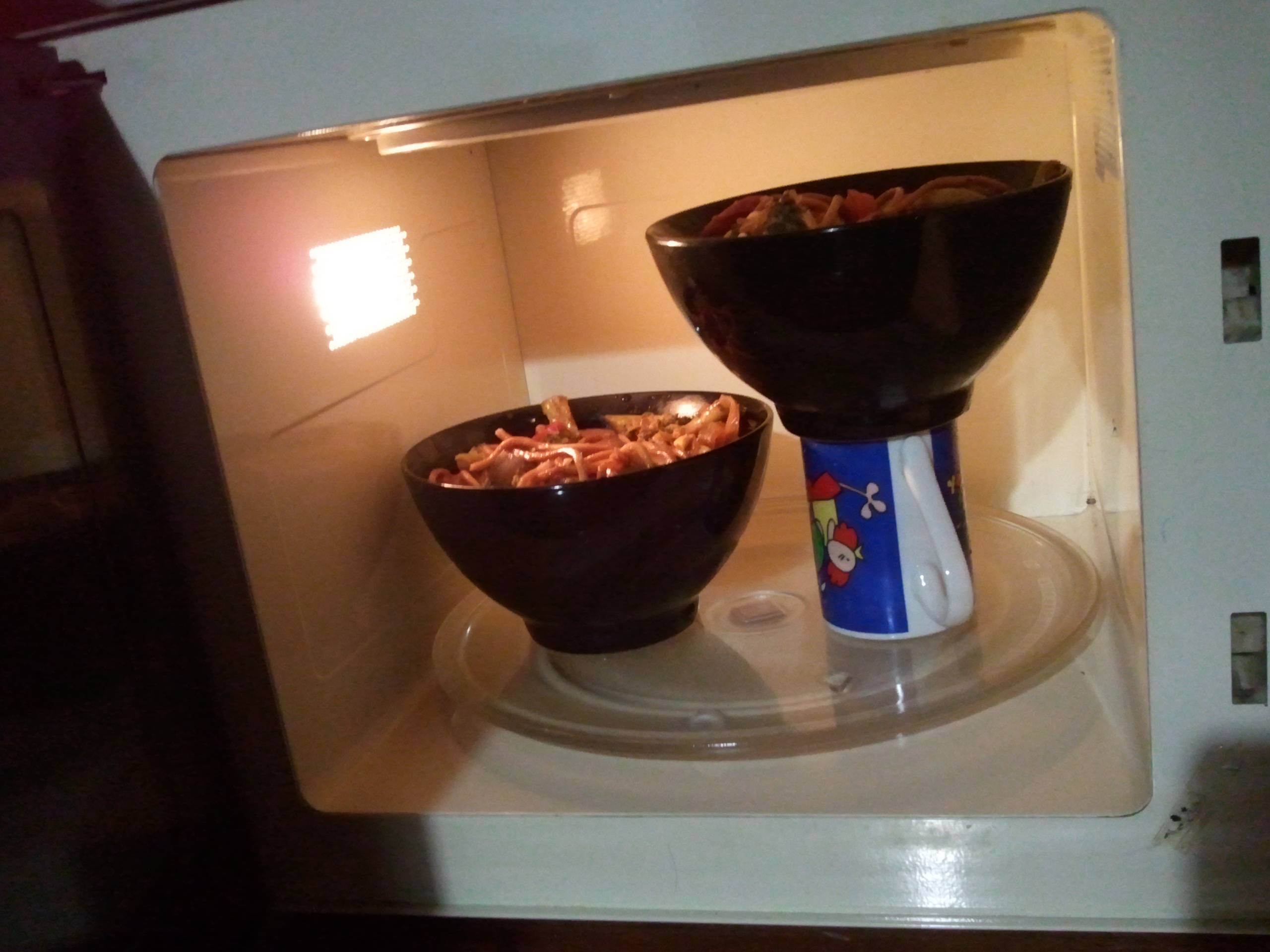 Optimize your microwave space with a coffee mug.